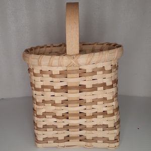 HAND WOVEN and signed oval basket with handle